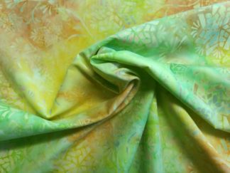 Stoff Tonga Batik Sorbet hellgrün-apricot-gelb Sternblumen