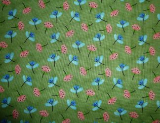 Stoff Andromeda Streublumen auf grün