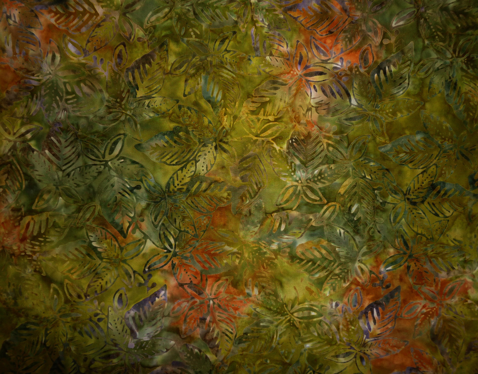 Stoff Batik Blätter olivgrün-ocker